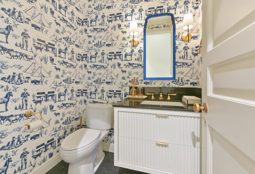 Playful wallpaper in a guest bathroom at 1069 Kirby Drive